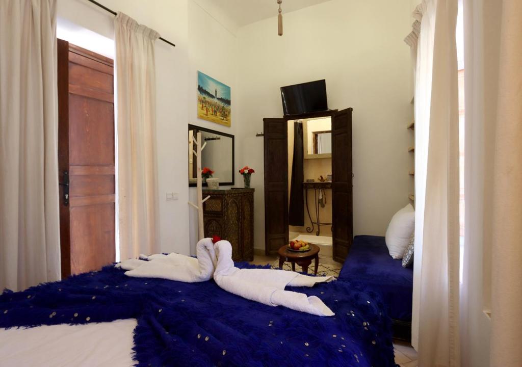 Postel nebo postele na pokoji v ubytování Riad Morocco Sky