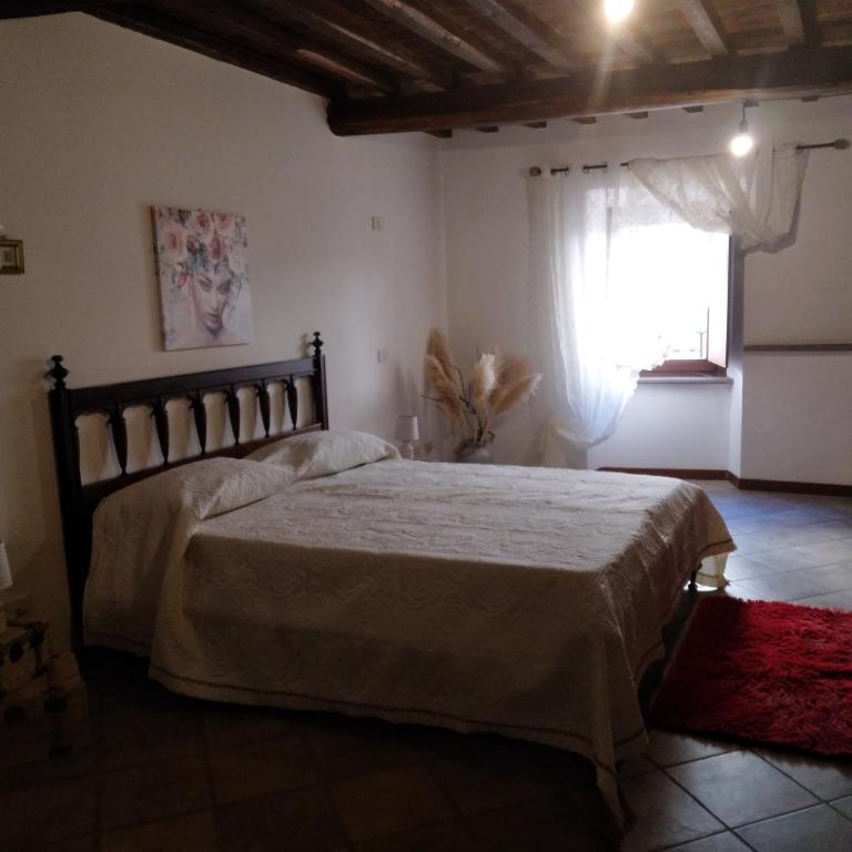 Łóżko lub łóżka w pokoju w obiekcie A casa di Grazia