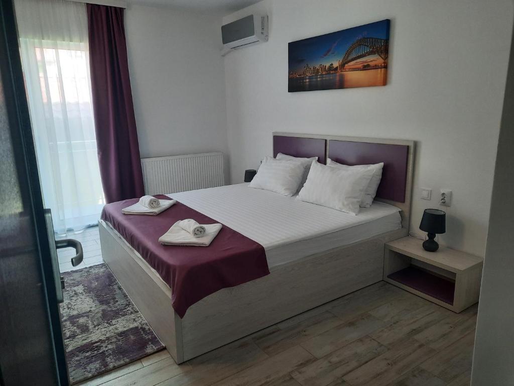 Postel nebo postele na pokoji v ubytování Vila Allure