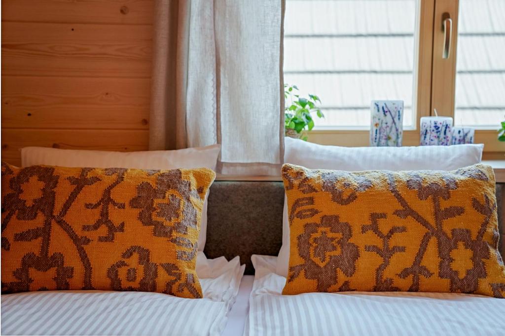 Postel nebo postele na pokoji v ubytování Osada Gąsienica Centrum Zakopane