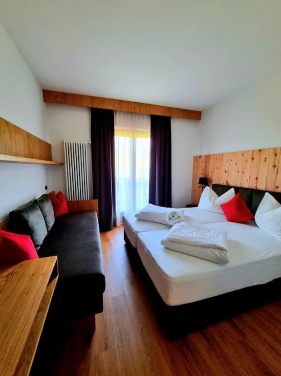 Postel nebo postele na pokoji v ubytování Hotel Brückenwirt - Al Ponte