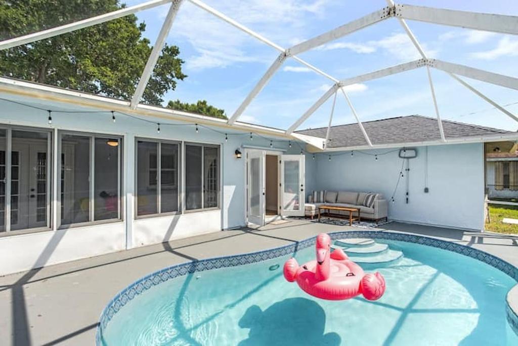 The swimming pool at or close to Family friendly 4BR Home in St Lucie Cty with Pool, BBQ and Firepit!
