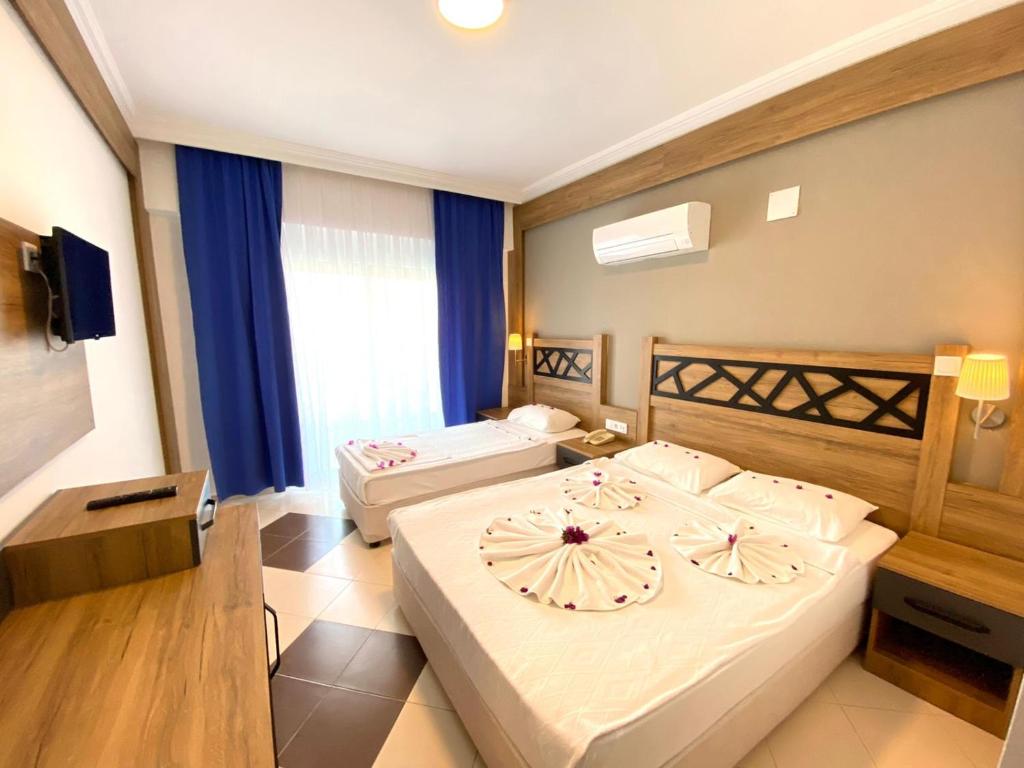 A bed or beds in a room at İstanbul Beach Hotel