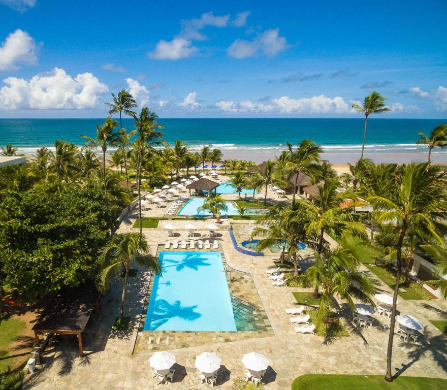 an aerial view of a resort with a pool and the beach at Hotel Village Porto De Galinhas in Porto De Galinhas