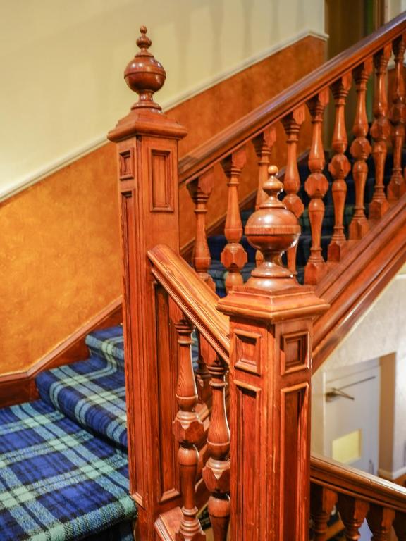 Postel nebo postele na pokoji v ubytování Rosehall Hotel
