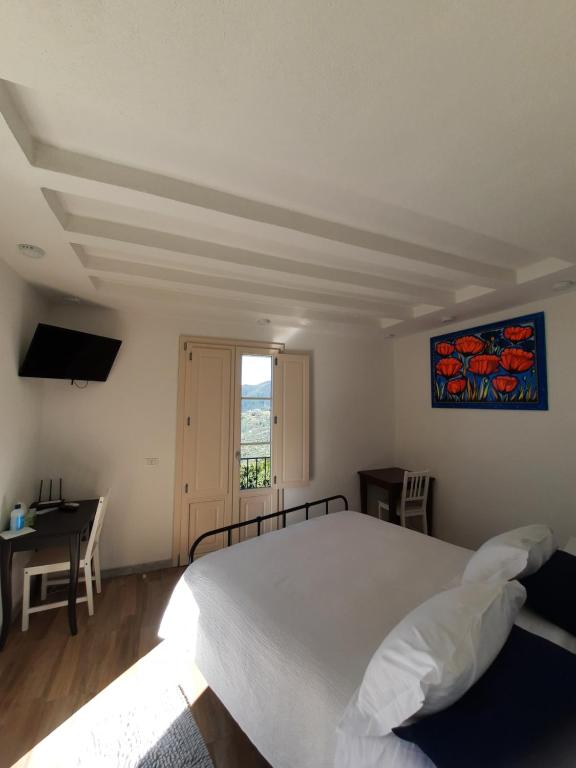 Postel nebo postele na pokoji v ubytování B&B Cà di Bollo
