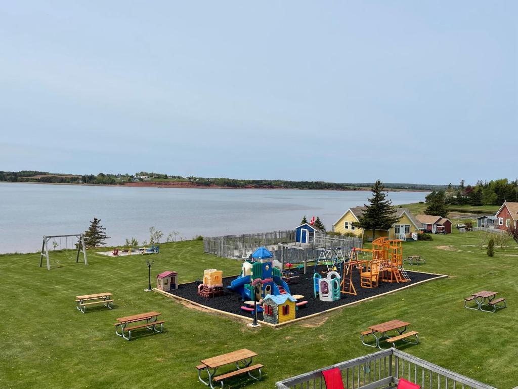a park with a playground with a play equipment at Beach & Breeze Cottages in Stanley Bridge