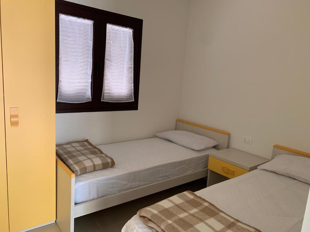 Postel nebo postele na pokoji v ubytování Camping Village Viareggio