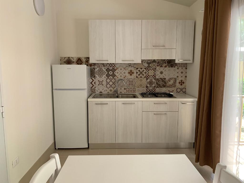 Kuchyň nebo kuchyňský kout v ubytování Camping Village Viareggio