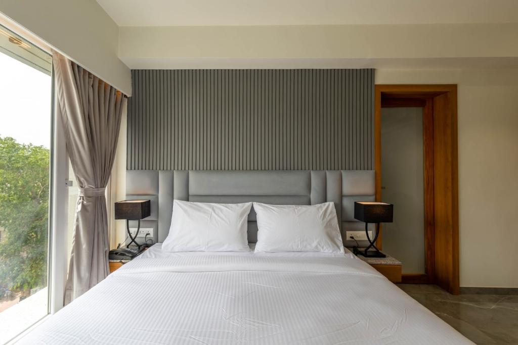 Postel nebo postele na pokoji v ubytování Hotel Nalanda