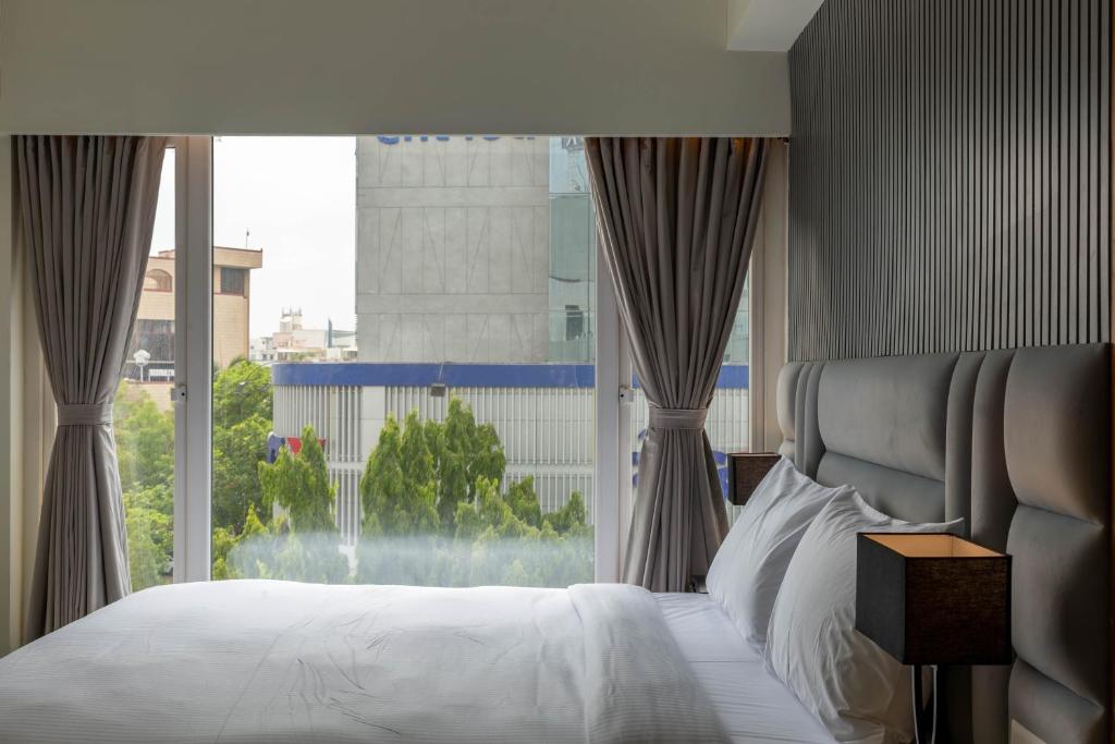 Postel nebo postele na pokoji v ubytování Hotel Nalanda