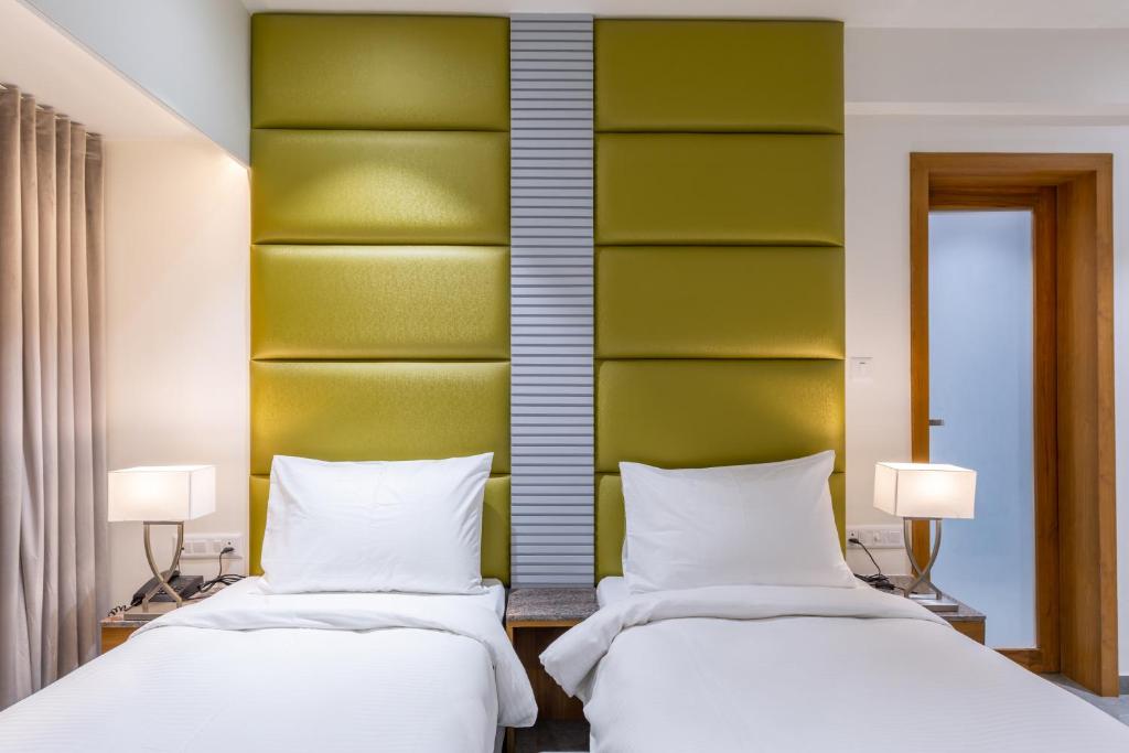 Postel nebo postele na pokoji v ubytování Hotel Nalanda