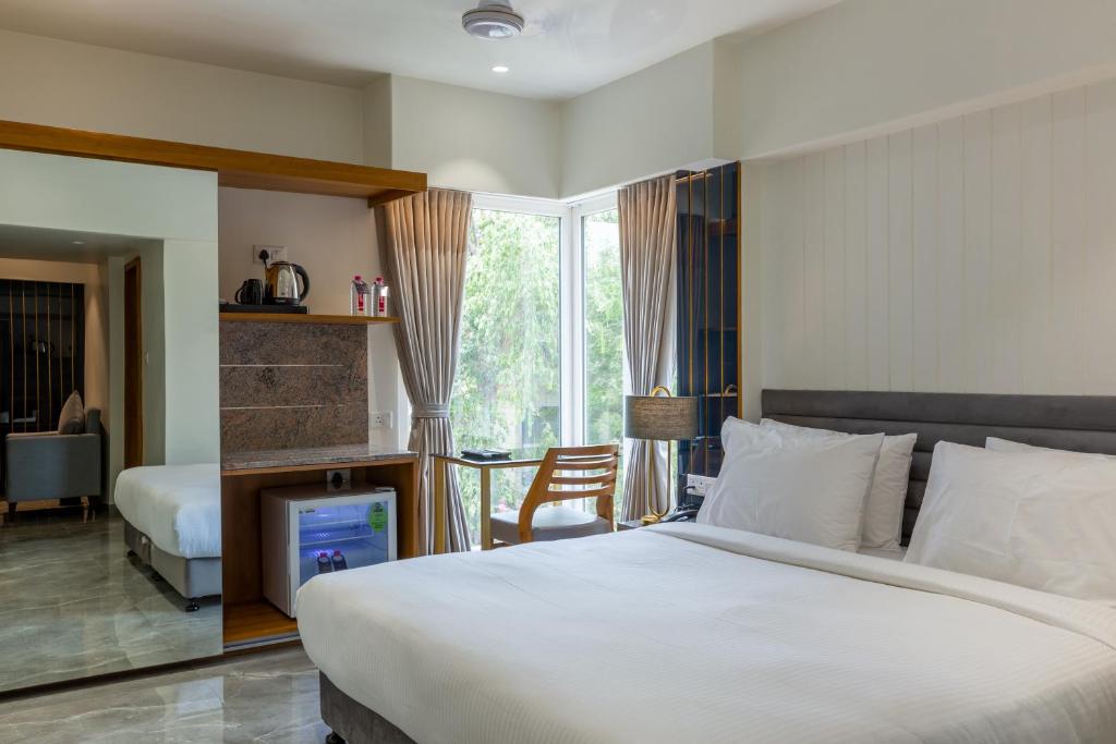 Postel nebo postele na pokoji v ubytování Hotel Nalanda
