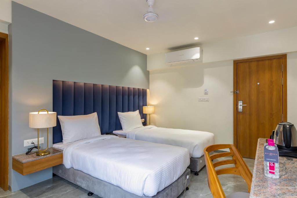 Postel nebo postele na pokoji v ubytování Hotel Nalanda