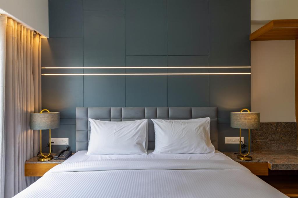Postel nebo postele na pokoji v ubytování Hotel Nalanda