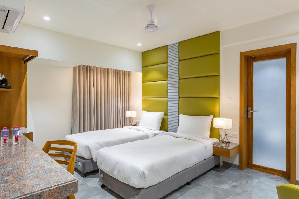 Postel nebo postele na pokoji v ubytování Hotel Nalanda