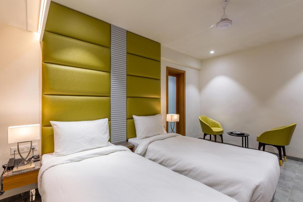 Postel nebo postele na pokoji v ubytování Hotel Nalanda
