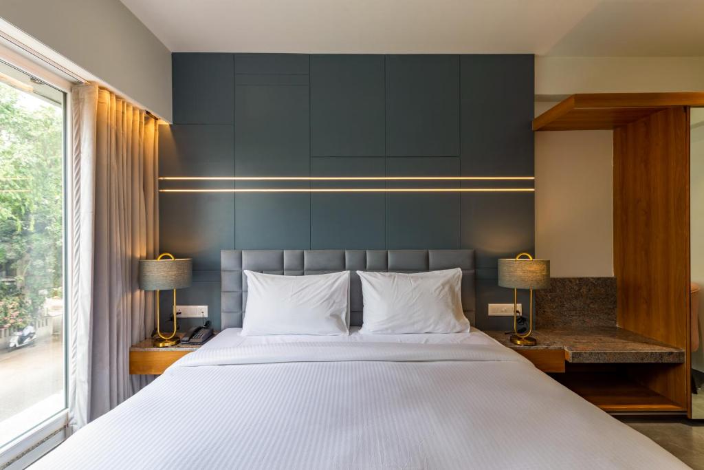 Postel nebo postele na pokoji v ubytování Hotel Nalanda