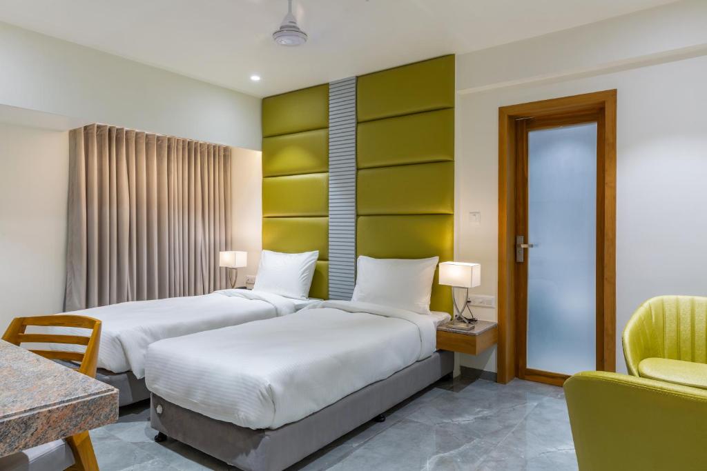 Postel nebo postele na pokoji v ubytování Hotel Nalanda