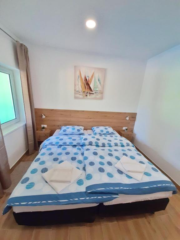 Postel nebo postele na pokoji v ubytování Pool and Villa Splav Dunavac