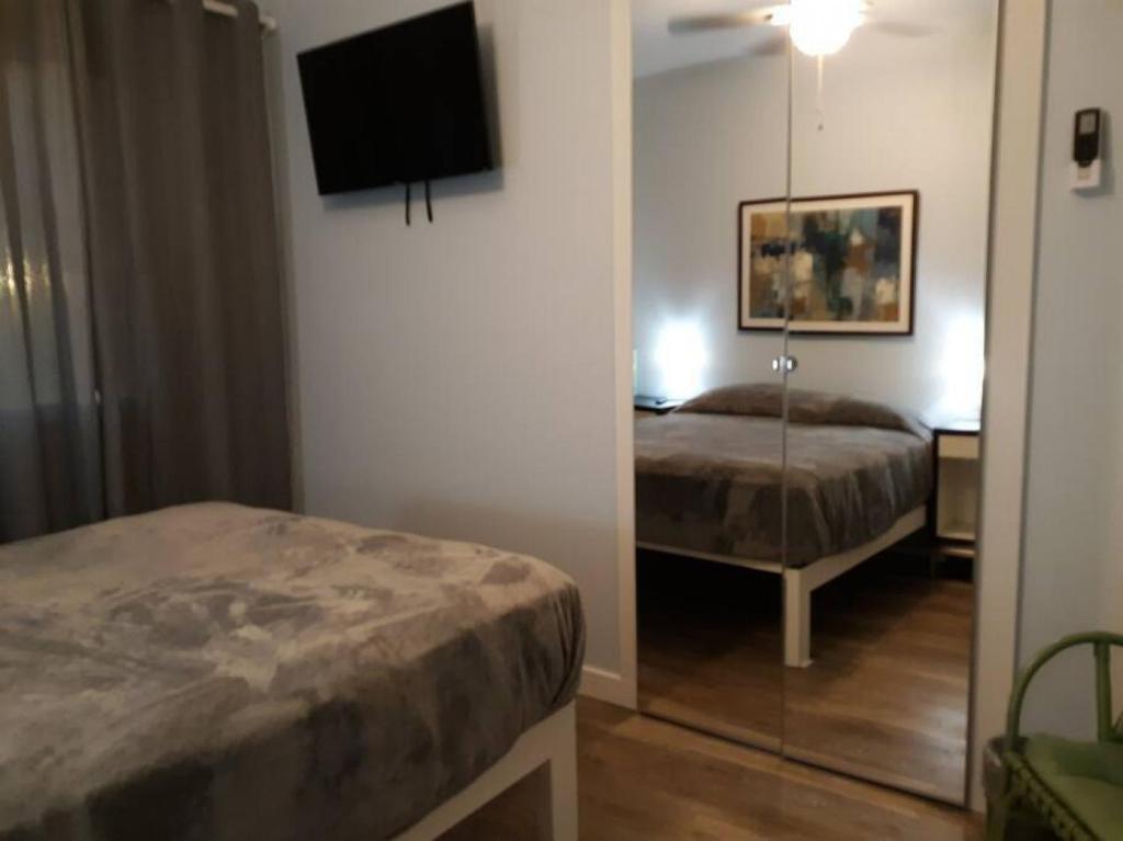 Postel nebo postele na pokoji v ubytování Las Casitas on Magnolia Beach - Casita A