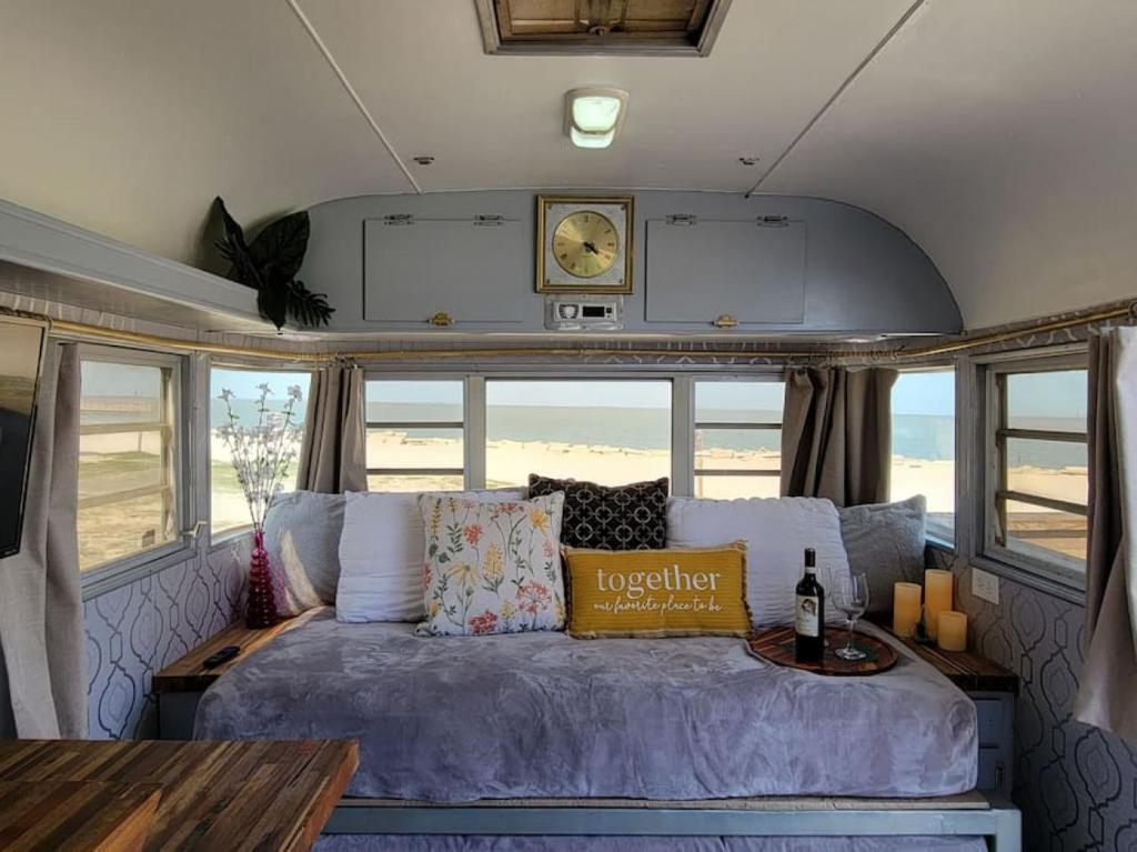 a bed in the back of a bus at Maggie At The Beach - 1973 Vintage RV in Port Lavaca