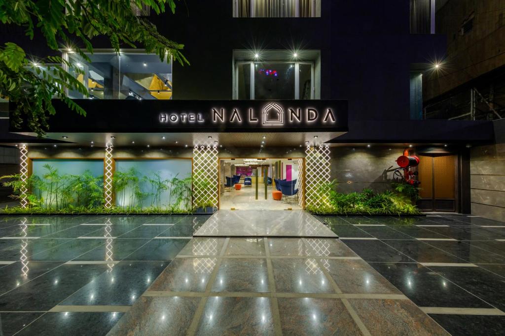 a building with a sign that reads higher malumbai at Hotel Nalanda in Ahmedabad
