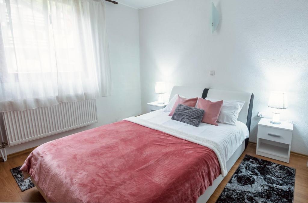 Postel nebo postele na pokoji v ubytování Alpin Apartments Vlašić