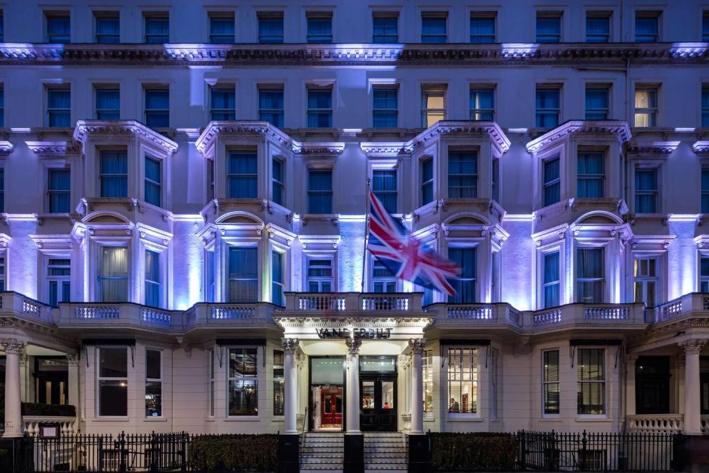 a building with the british flag in front of it at Radisson Blu Vanderbilt Hotel, London in London