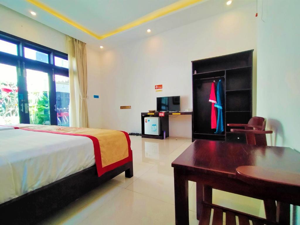 Postel nebo postele na pokoji v ubytování Almond Villa Hoi An