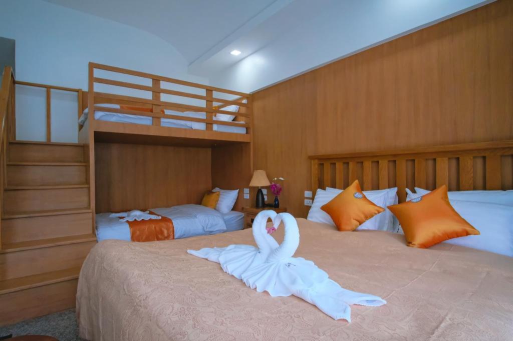 Postel nebo postele na pokoji v ubytování Cha Li's Family Hotel&Hostel