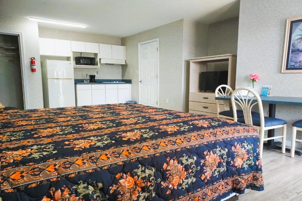 Kuchyň nebo kuchyňský kout v ubytování Studio Inn and Suites