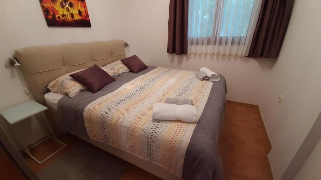 Posteľ alebo postele v izbe v ubytovaní Apartments Agrijan