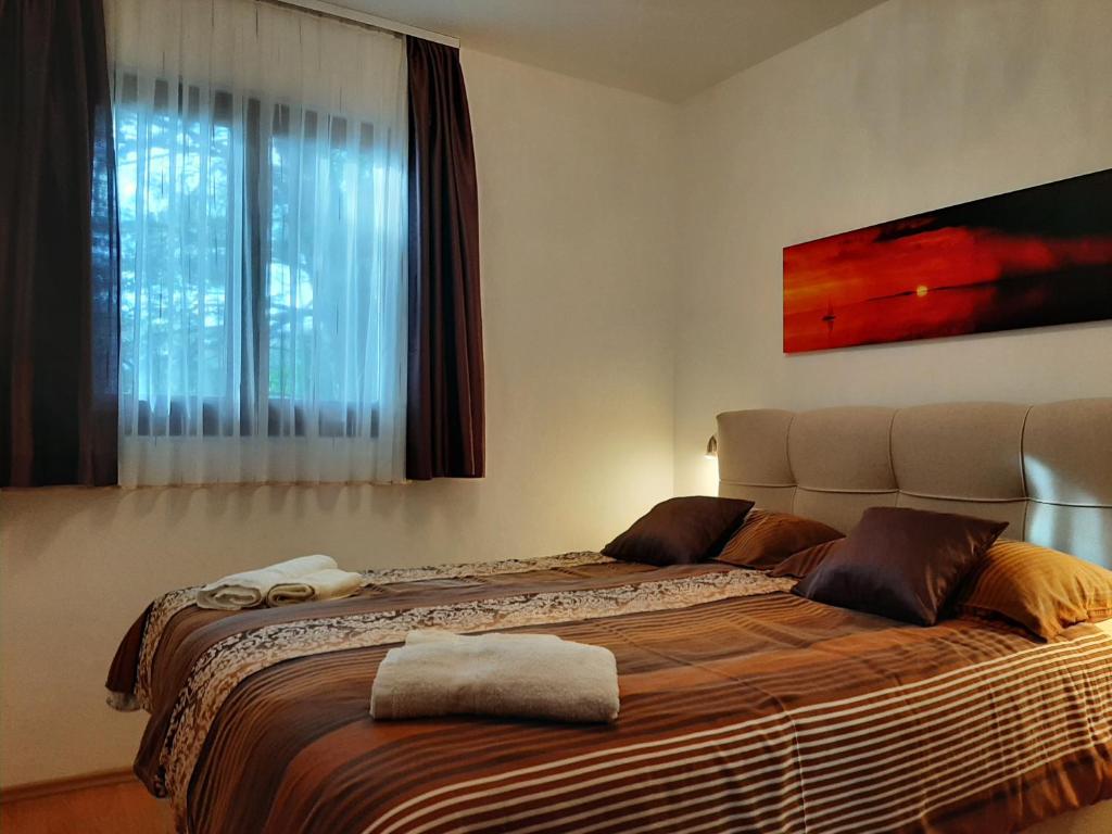 Posteľ alebo postele v izbe v ubytovaní Apartments Agrijan
