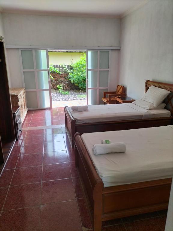 Postel nebo postele na pokoji v ubytování Hotel SeaSide lovina