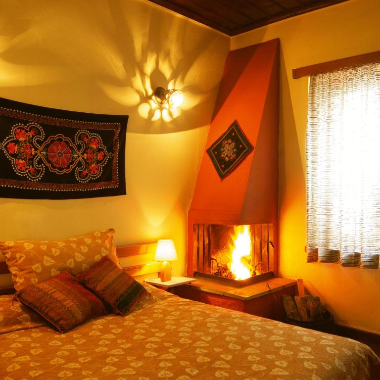 Postel nebo postele na pokoji v ubytování Hotel Galaxias