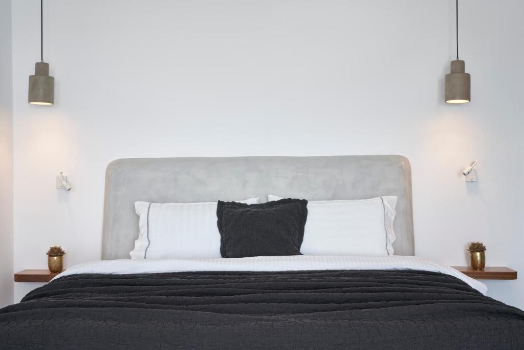 Postel nebo postele na pokoji v ubytování Apanemo Hotel & Suites