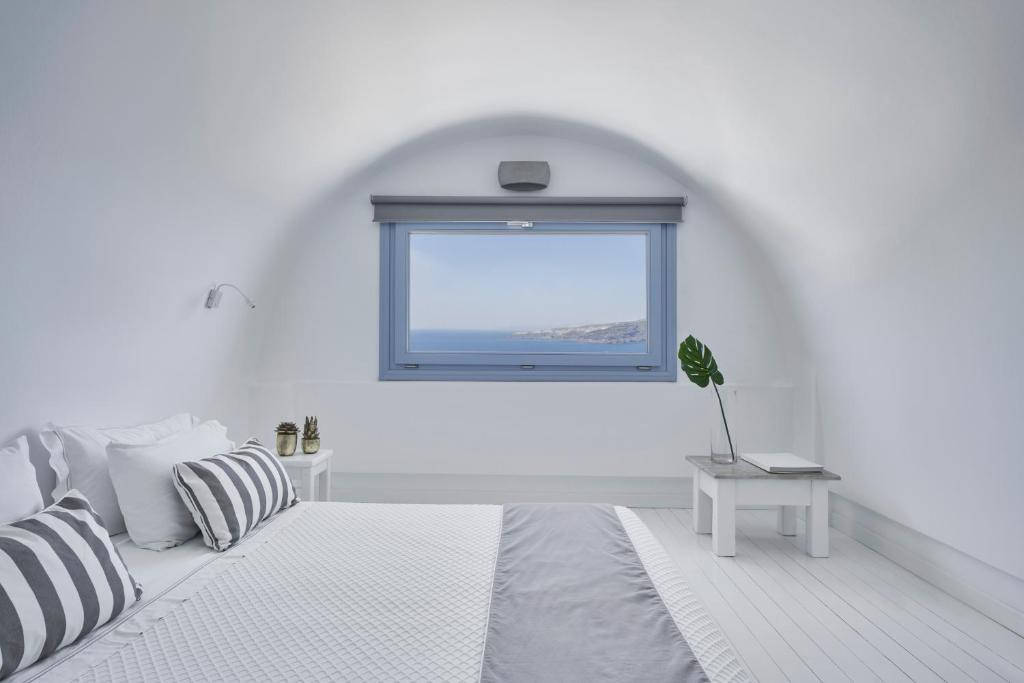 Postel nebo postele na pokoji v ubytování Apanemo Hotel & Suites
