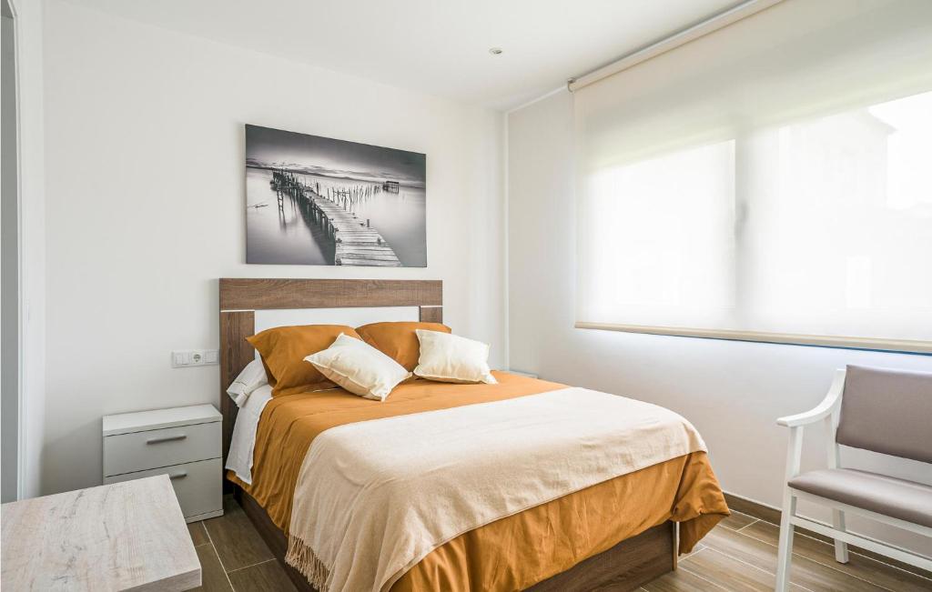 A bed or beds in a room at Awesome Home In Noia With Wifi