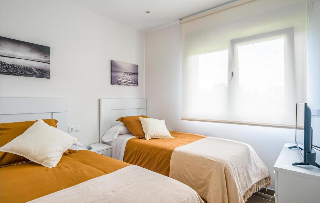 A bed or beds in a room at Awesome Home In Noia With Wifi