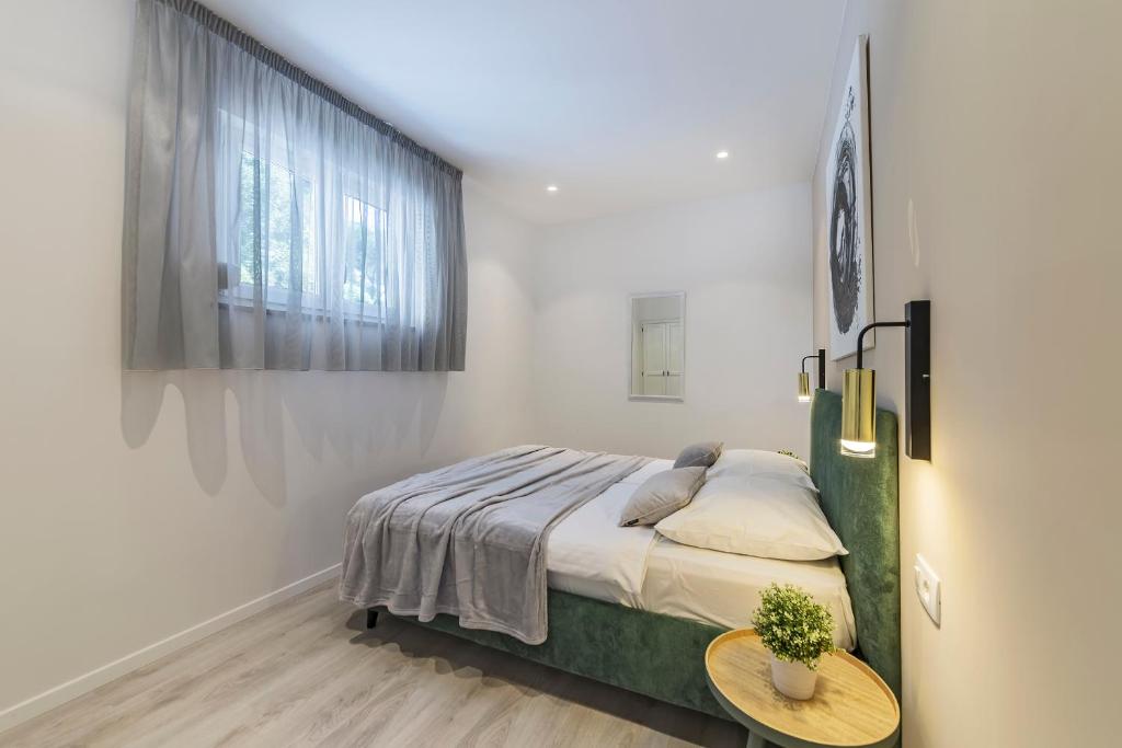 Posteľ alebo postele v izbe v ubytovaní Apartment Zulijani A4