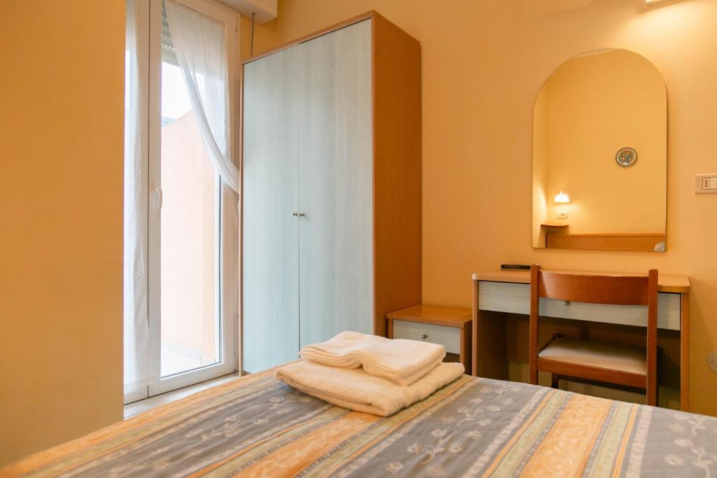 Postel nebo postele na pokoji v ubytování HOTEL VALPARAISO