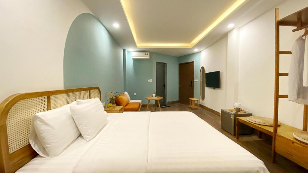 Postel nebo postele na pokoji v ubytování Lacovy Home Hội An