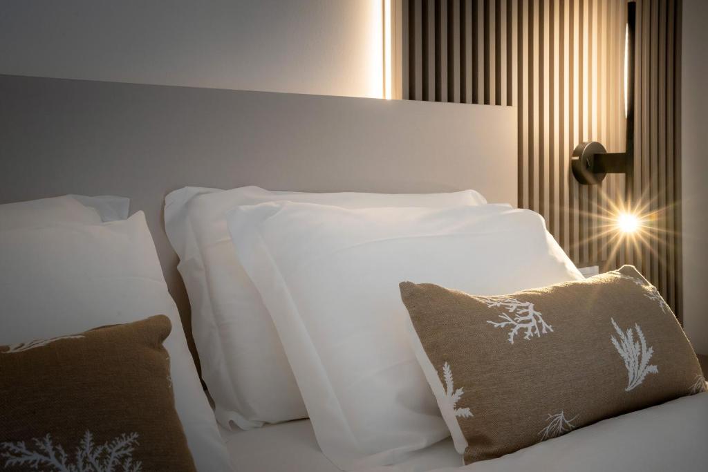 Posteľ alebo postele v izbe v ubytovaní Hotel Delfino