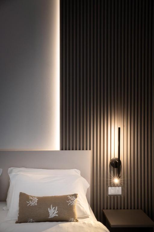 Posteľ alebo postele v izbe v ubytovaní Hotel Delfino