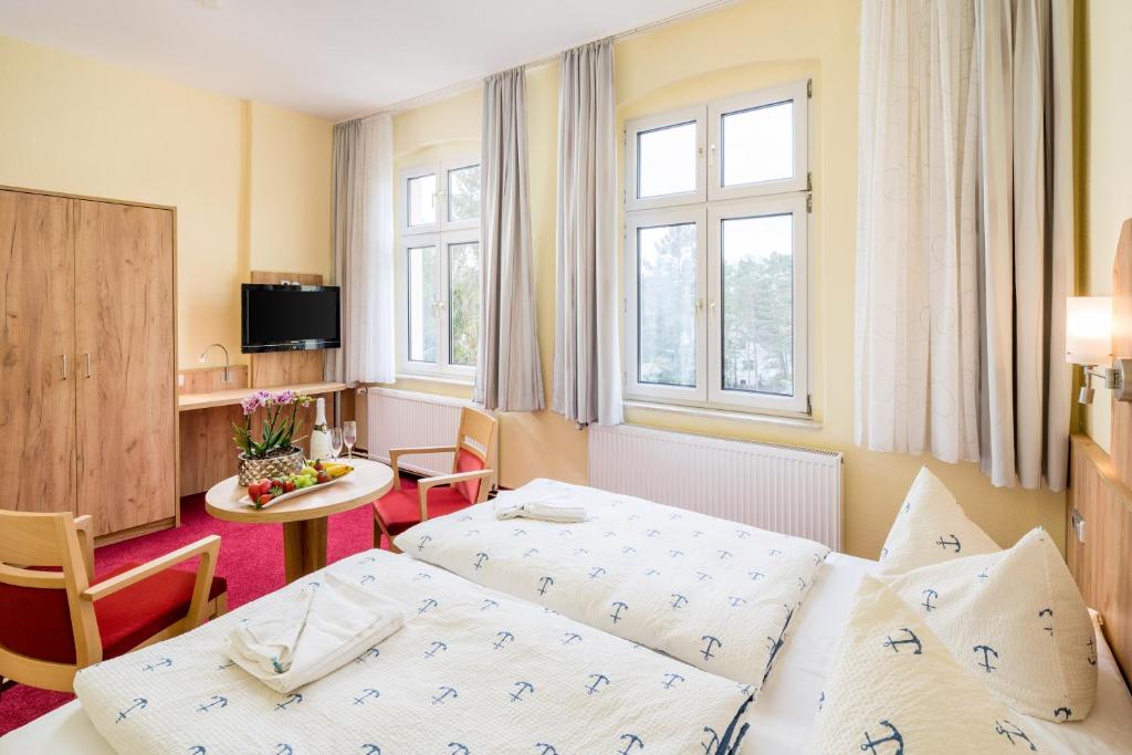 Postel nebo postele na pokoji v ubytování Hotel Seestern