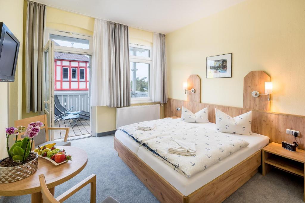 Postel nebo postele na pokoji v ubytování Hotel Seestern