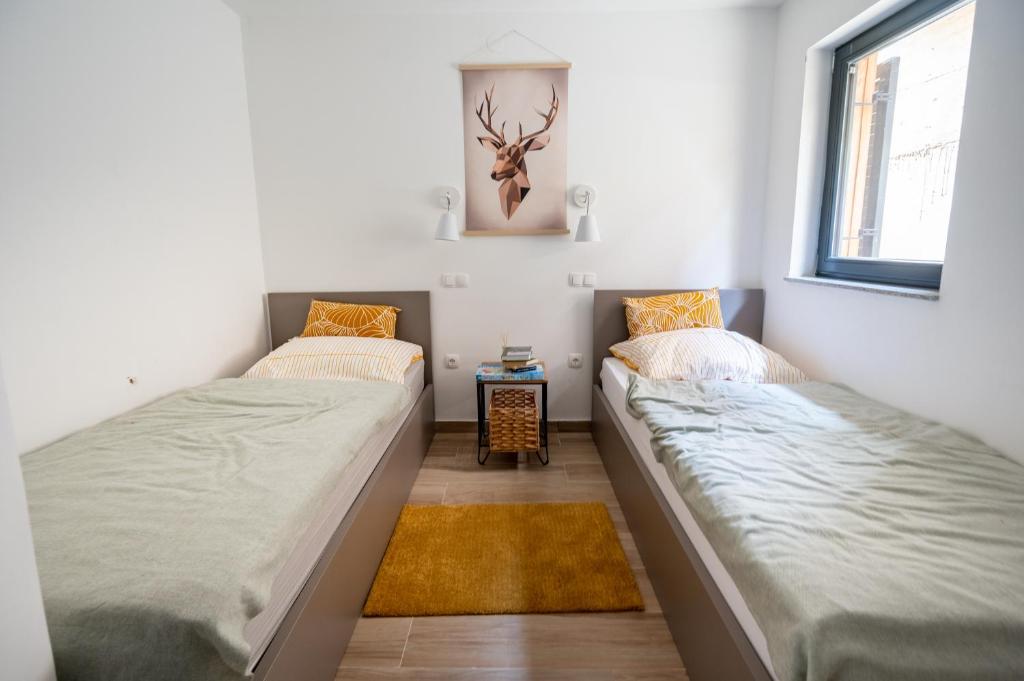 Postel nebo postele na pokoji v ubytování Apartment MOUNTAIN BLOOM Golte