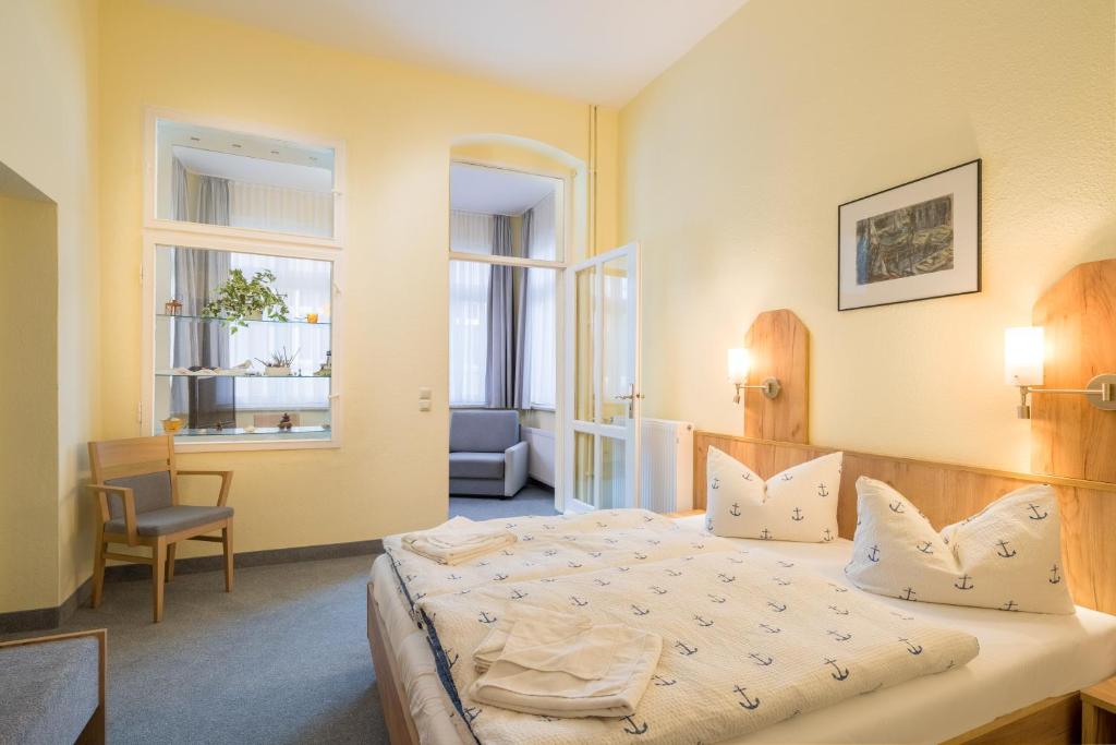 Postel nebo postele na pokoji v ubytování Hotel Seestern