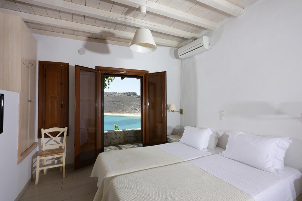 Postel nebo postele na pokoji v ubytování Albatros Club Mykonos
